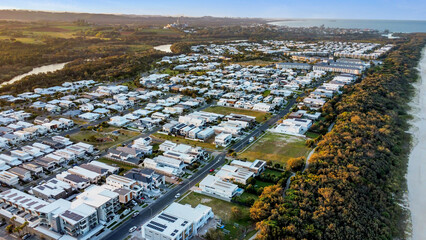Sunset drone aerial view of beachfront properties at Salt Kingscliff overlooking coastline and ocean
