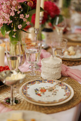 Summer brunch, vintage tableware, a table decorated with pink elements and flowers, champagne glasses, and a feminine gathering