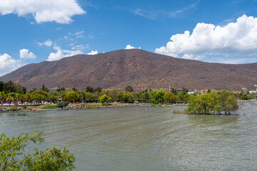 Beautiful natural landscape showing mountain and lakefront greenery in Jocotepec on sunny day