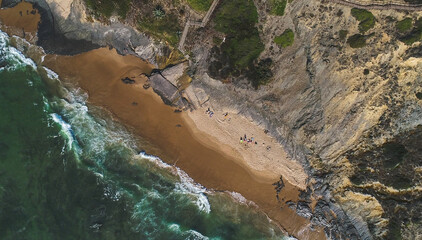 Aerial drone photo showing a stunning top view of the Atlantic coastline in Portugal with turquoise...