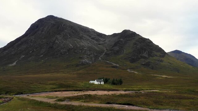 Aerial view of a cottage in a remote location of the highlands in Scotland