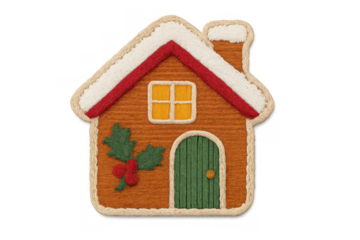Gingerbread house textile craft featuring white snow, red roofline, green door, and holly creating a cozy christmas decor, transparent background