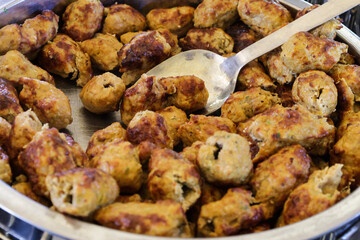 Golden Brown Cooked Meatballs or Sausage Balls in Serving Dish
