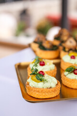 Elegant bite-sized pastries with earthy mushrooms and fresh herbs - ideal for upscale catering, wedding receptions or gourmet food visuals.