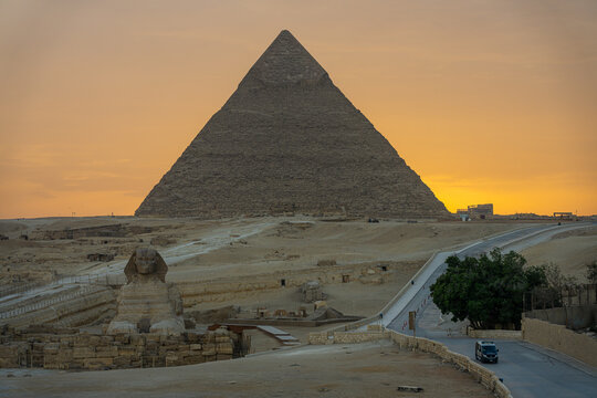 Golden sunset view of the Great Sphinx and Pyramid of Khafre at Giza
