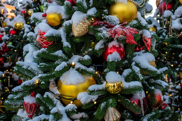 Christmas tree and New Year decorations on the town square on a frosty winter day.