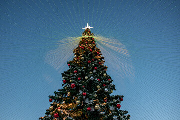 Christmas tree and New Year decorations on the town square on a frosty winter day.