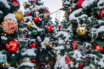 Christmas tree and New Year decorations on the town square on a frosty winter day.