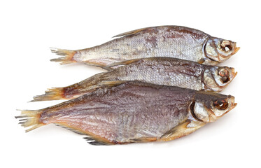 Three dried fish on white background.