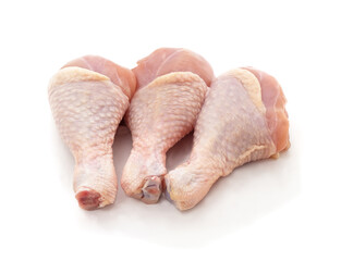 Raw chicken drumsticks isolated on white.