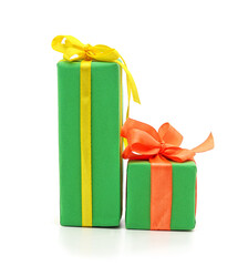 Two green gift boxes with colorful ribbons.