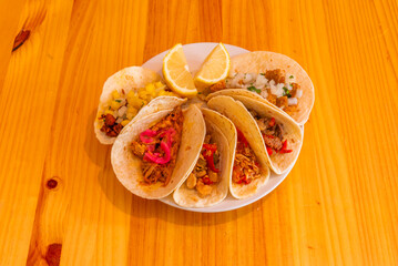 Chipotled shrimp tacos with creamy chipotle sauce, avocado, and red onion on double tortillas