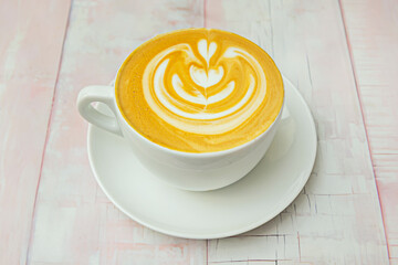 Moroccan coffee with cardamom and cinnamon in a colorful cup with traditional geometric decorations