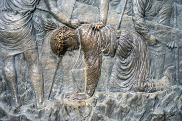 Station III: Jesus falls for the first time. The Way of the Cross on Mount Križevac (the Cross Mountain) in Medjugorje.