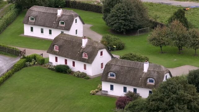 Typical Irish White Washed Houses with Thatched Roof. Authentic and Historical Cozy Cottage in Ireland, Aerial View