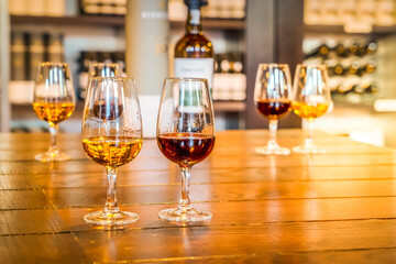 Fototapeta premium port wine testing, glasses with drink samples in bar