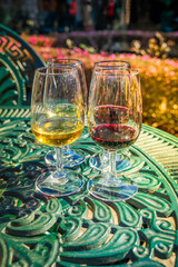 Fototapeta premium port wine testing, glasses with drink, white and red