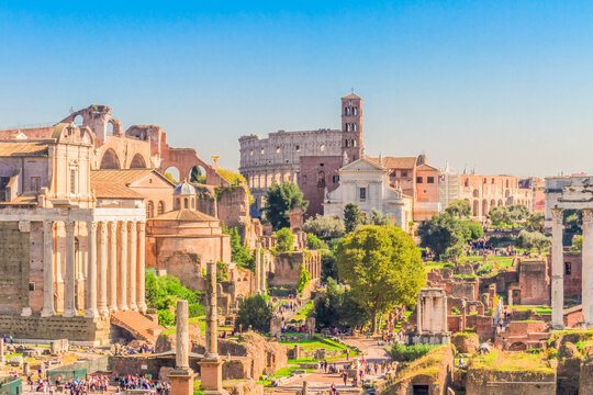 Forum - antique Roman ruins with Colosseum in Rome at sunny day, Italy