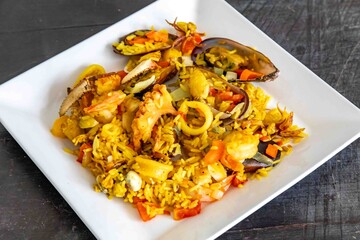 Delicious Seafood Paella with Mussels, Shrimp, and Calamari