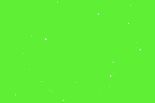 Animated white particles sparkle and drift on vibrant green screen loop