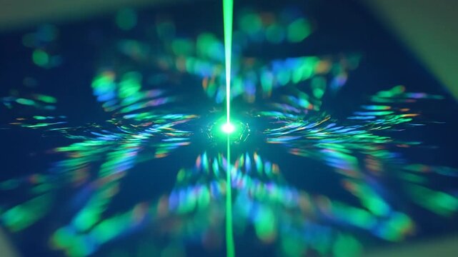 Abstract Green Laser Light Creating a Complex Diffraction Pattern.
