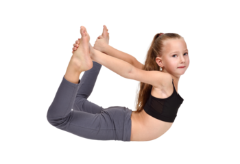 Girl in yoga pose wearing gray leggings and black crop top.