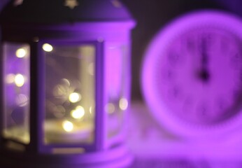 new year Christmas photo with candle lamp and clock lights bokeh festive background 