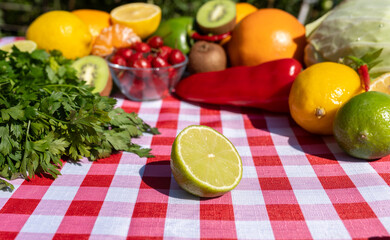 Colorful mix of vitamin C rich foods – citrus, kiwi, peppers, parsley – promoting health, wellness, and strong immunity. Natural sources of vitamin C representing balanced diet.