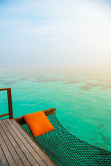 Tranquil closeup calm sea water waves with palm trees. Beautiful Panorama, Tropical island beach landscape exotic shore coast. Summer vacation, holiday amazing nature. Relax paradise, Maldives.