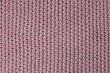Soft pink knitted fabric texture with woven pattern for background use