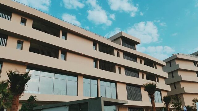 Residential Cream Color 04 Story building modern design Exterior View with Balcony black glass windows.
Aluminum Baffle Shape Cladding Balcony Facade Architecture Panel Decoration Horizontal Tower.