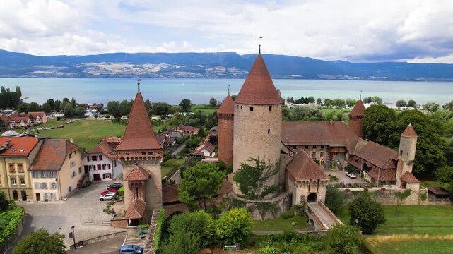 Switzerland tourism and scenic places. Estavayer-le-lac - charming traditional village, lake Neuchatel. aerial drone 4k hd video of medieval castle and old town. Canton Fribourg