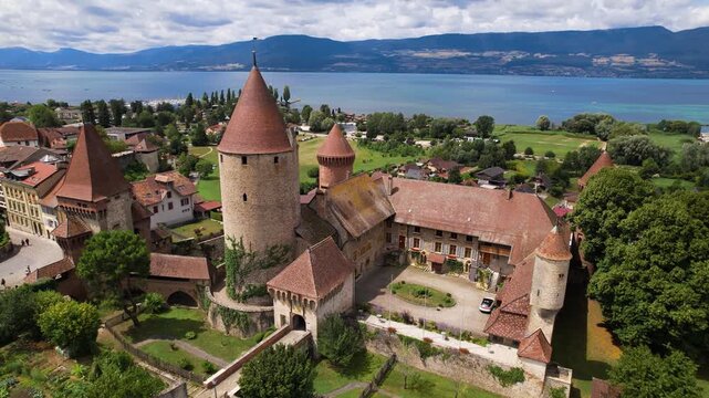 Switzerland tourism and scenic places. Estavayer-le-lac - charming traditional village, lake Neuchatel. aerial drone 4k hd video of medieval castle and old town. Canton Fribourg