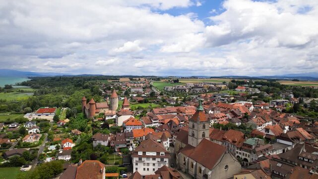 Switzerland tourism and scenic places. Estavayer-le-lac - charming traditional village, lake Neuchatel. aerial drone 4k hd video of medieval castle and old town. Canton Fribourg