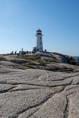 Peggys Cove, Canada - October 06, 2025: Peggys Point Lighthouse, also known as Peggys Cove Lighthouse, is an active lighthouse and an iconic Canadian image.