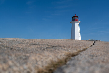 Peggys Cove, Canada - October 06, 2025: Peggys Point Lighthouse, also known as Peggys Cove Lighthouse, is an active lighthouse and an iconic Canadian image.