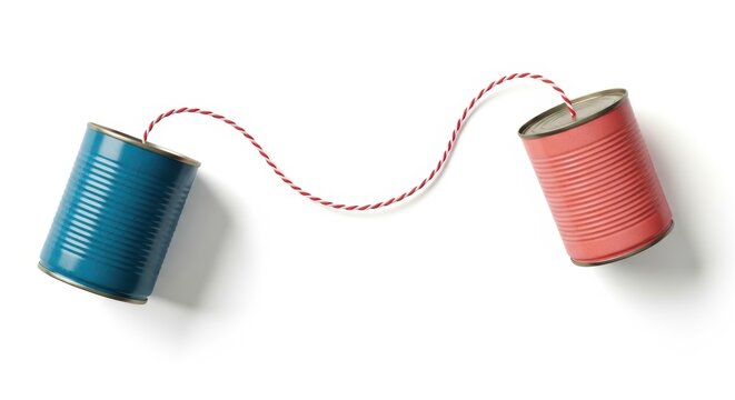 Creative communication concept with tin cans connected by red twine on white background