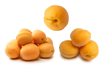 Ripe juicy orange apricots isolated on white background.