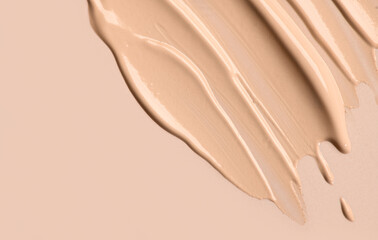 Foundation, concealer, face makeup smudge, smears border. Cosmetic liquid foundation or cream beige color smudges, stroke. Contouring, Make up background. Foundation texture surface, bb, cc cream