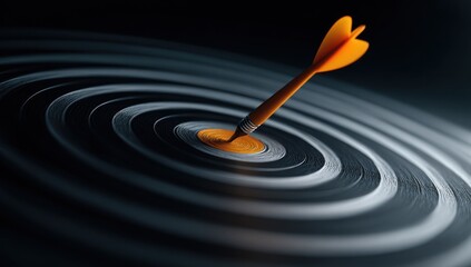 Orange dart hitting bullseye on dark concentric target surface.
