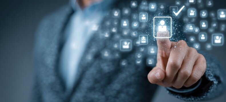 Finger selecting a glowing user icon on a digital interface.