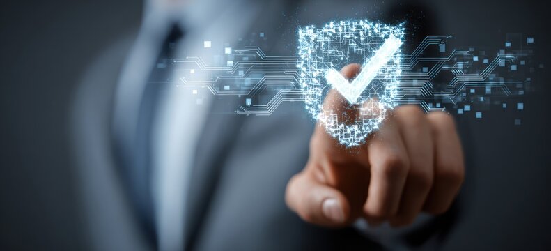 Businessman finger touches glowing digital security shield icon