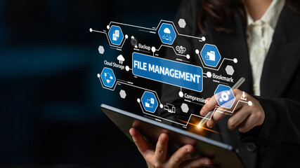A professional individual interacts with a tablet, showcasing file management concepts like cloud storage and backup through digital icons and interfaces, reflecting modern business practices. Tessel