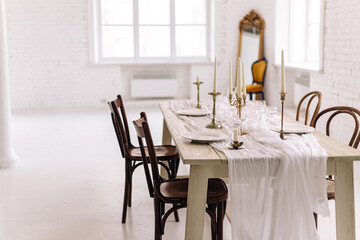 Elegant dining room with vintage decor and white brick walls