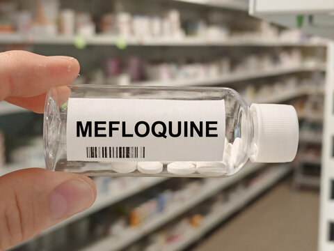 Box of MEFLOQUINE tablets on a hospital pharmacy table used to prevent and treat malaria an antimalarial.