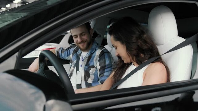 Smiling woman using seat belt during studying drive with instructor. Slow motion