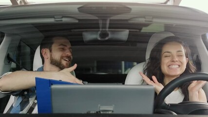 Happy lady celebrating successfully passing a driving test. Slow motion