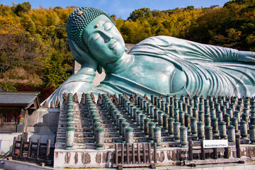 A huge reclining Buddha in Nanzo-in Temple near Fukuoka, Kyushu, Japan (sign: do not go up the stairs)