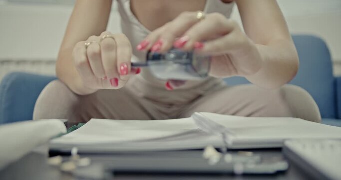 Close-up of a woman's hands precisely sharpening a pencil and then drawing on paper, featuring the satisfying and crisp ASMR sounds of the actions. Ideal for relaxation and focus.