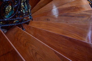 a teak wood stairs or staircase, Spiral teak steps inside a luxury house
